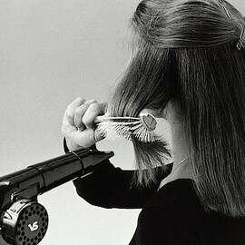 Model Blow Drying Hair by Mike Reinhardt