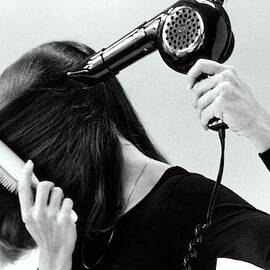 Model Blow Drying Hair by Mike Reinhardt