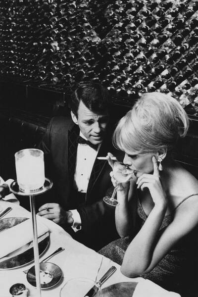 A Glamorous 1960s Couple Dining Art Print