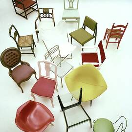 A Large Group Of Chairs by Herbert Matter