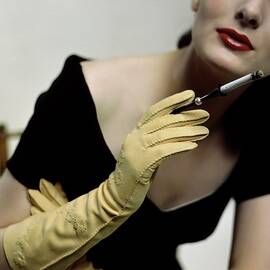 A Model Holding A Alfred Orlik Cigarette Holder by Serge Balkin