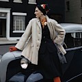 A Model Leaning On A Vintage Car