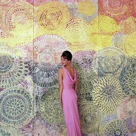 A Model Posing By A Colorful Mural by William Bell