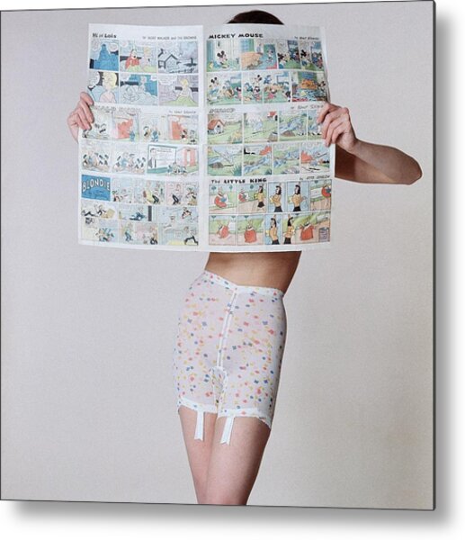 A Model Wearing A Girdle With A Comic Metal Print