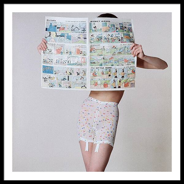 A Model Wearing A Girdle With A Comic Framed Print