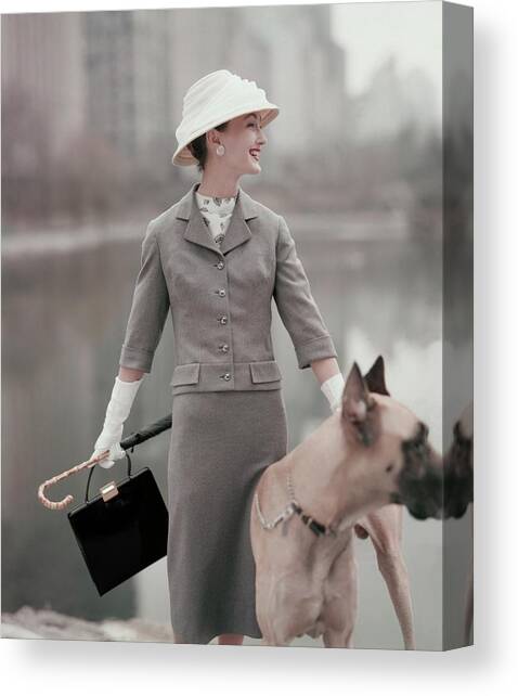 A Model Wearing A Gray Suit With A Dog Canvas Art Print by Karen Radkai