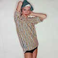 A Model Wearing Swimwear And A Striped Shirt
