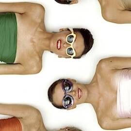 A Row Of Models In Strapless Tops And Sunglasses by Richard Rutledge