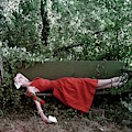 A Woman Lying On A Bench