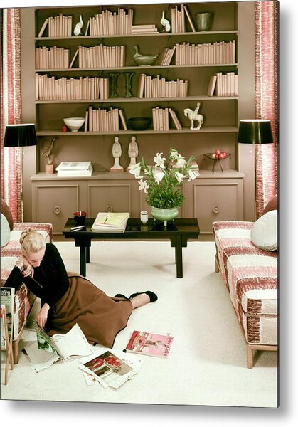 A Woman Reading Magazines On The Floor Metal Print