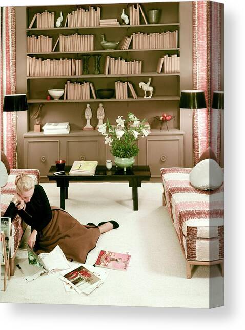 A Woman Reading Magazines On The Floor Canvas Art Print by Haanel Cassidy