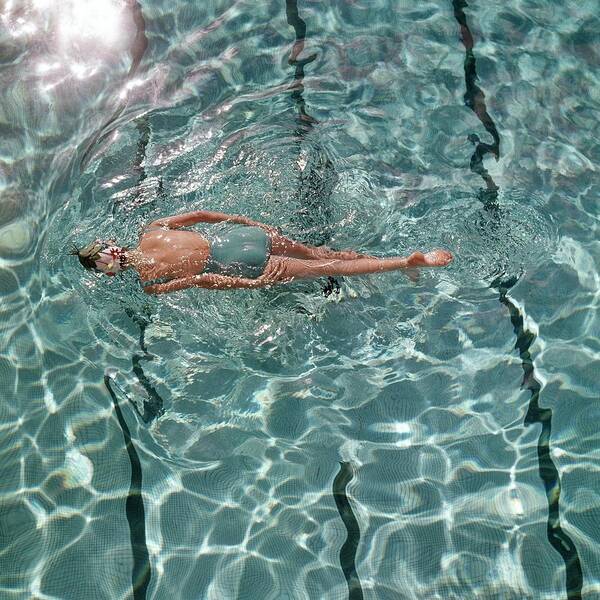 A Woman Swimming In A Pool Art Print
