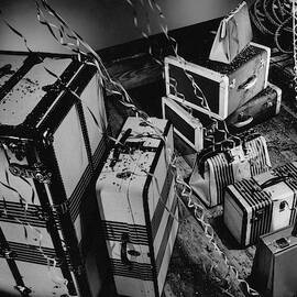 An Assortment Of Luggage With Confetti Falling by Martin Bruehl