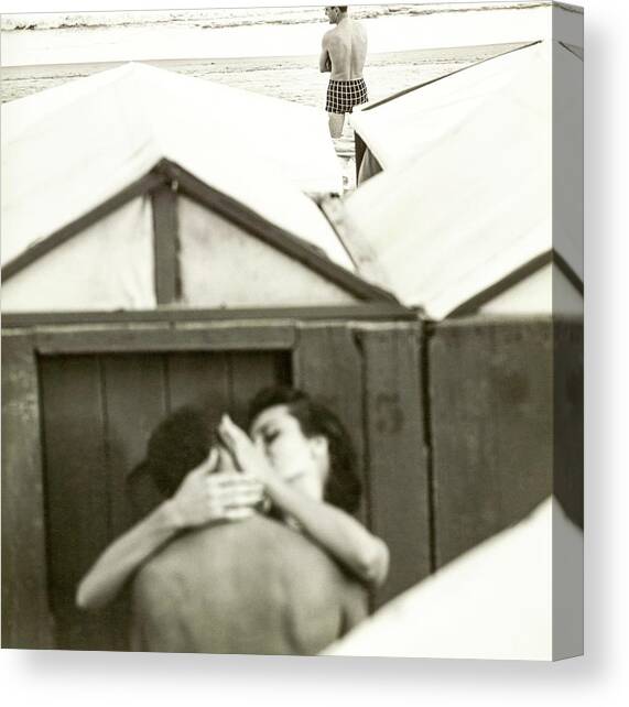 Couple Kissing By A Model Wearing Westwood Trunks Canvas Art Print by Chadwick Hall
