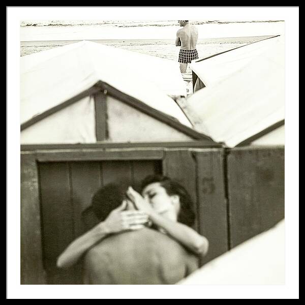 Couple Kissing By A Model Wearing Westwood Trunks Framed Print