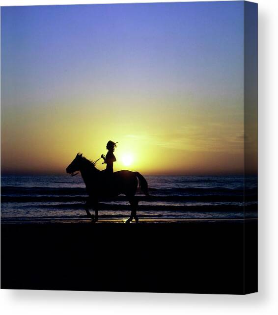 Margaux Hemingway on Horseback Canvas Art Print by Francesco Scavullo