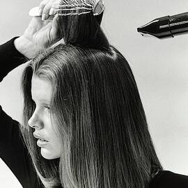 Model Blow Drying Hair by Mike Reinhardt