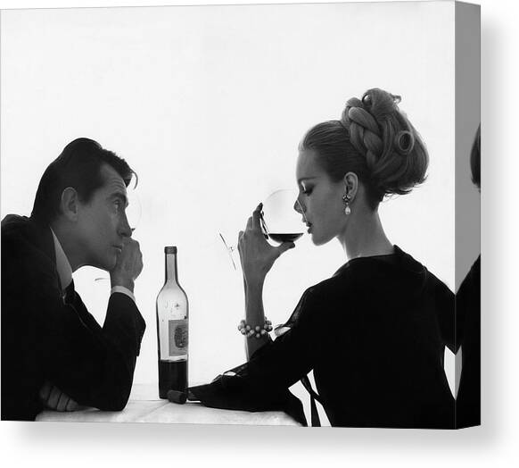 Man Gazing at Woman Sipping Wine Canvas Art Print by Bert Stern