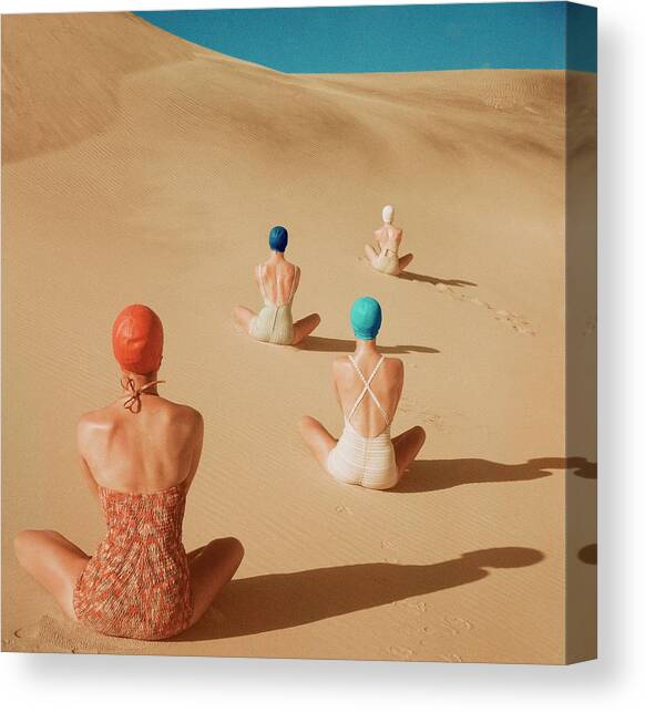 Models Sitting On Sand Dunes Canvas Art Print by Clifford Coffin