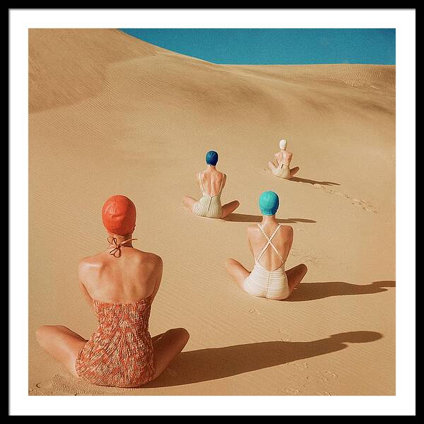 Models Sitting On Sand Dunes Framed Print