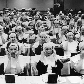 Rows Of Women Learning Facial Massage by Constantin Joffe