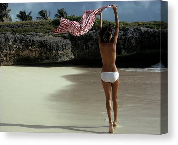 Topless Model Walking on a Beach Canvas Art Print by Mike Reinhardt