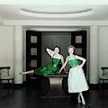 Two Models Posing By A Table
