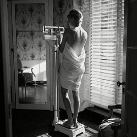 Woman Weighing Herself by Frances McLaughlin-Gill